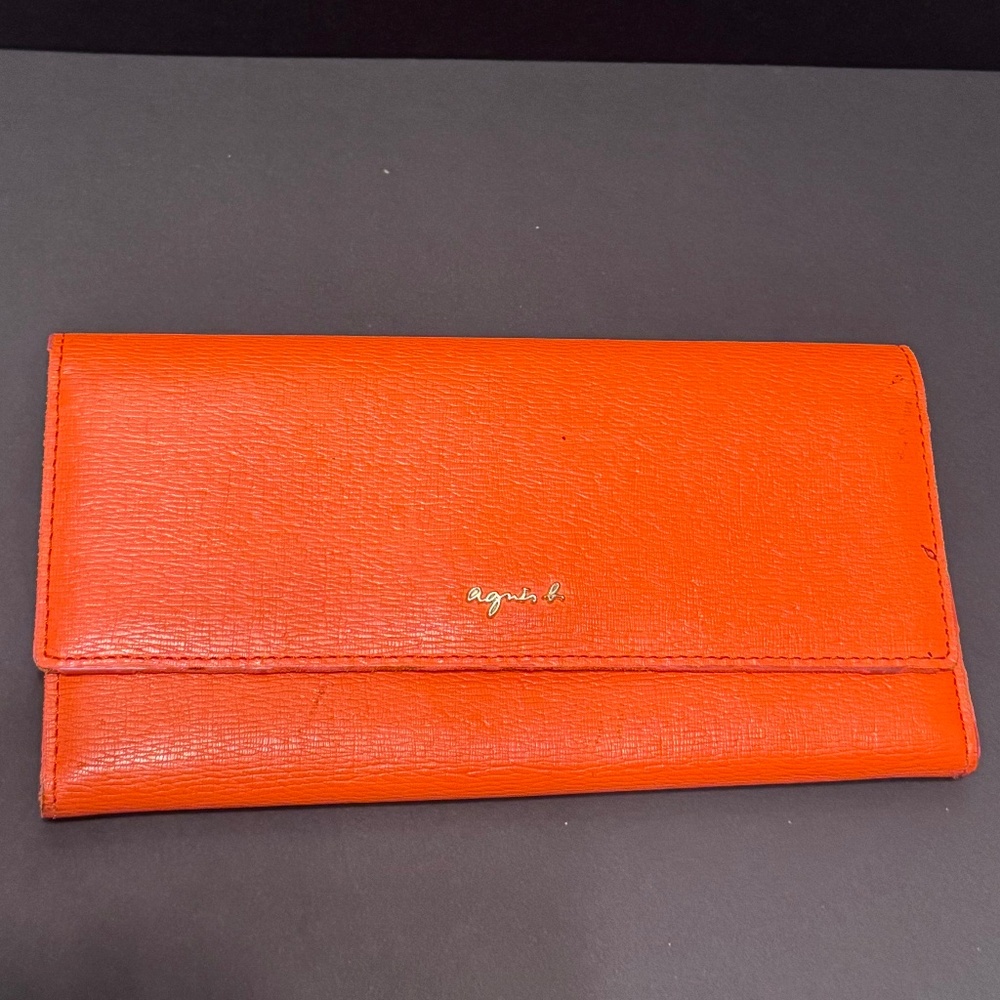 Wallet by Agnès b. Orange.